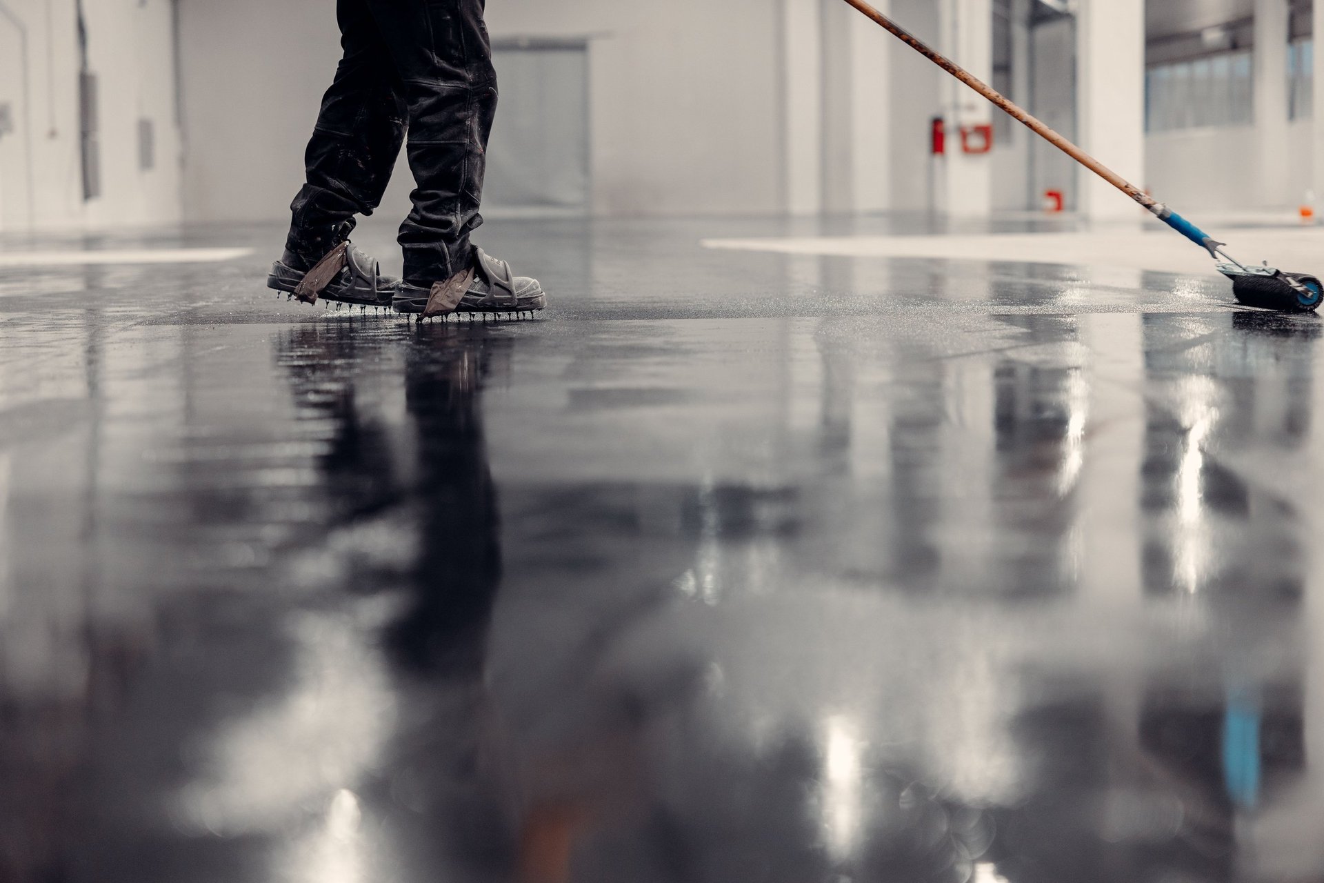 Worker applying epoxy coating